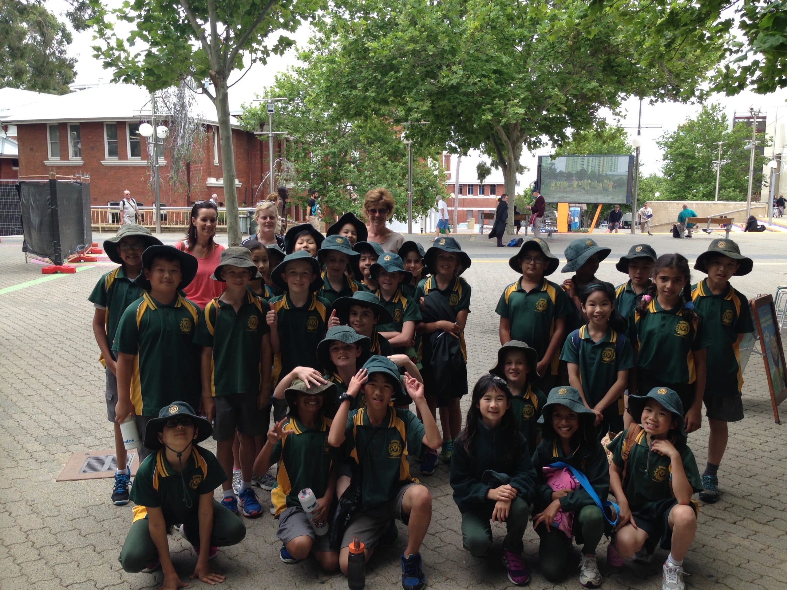 School group with guide exploring heritage buildings in central Perth